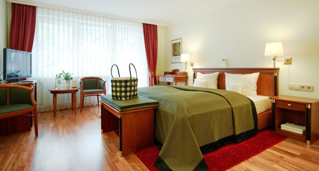 Schlafzimmer in grün im Zimmertyp Auslese